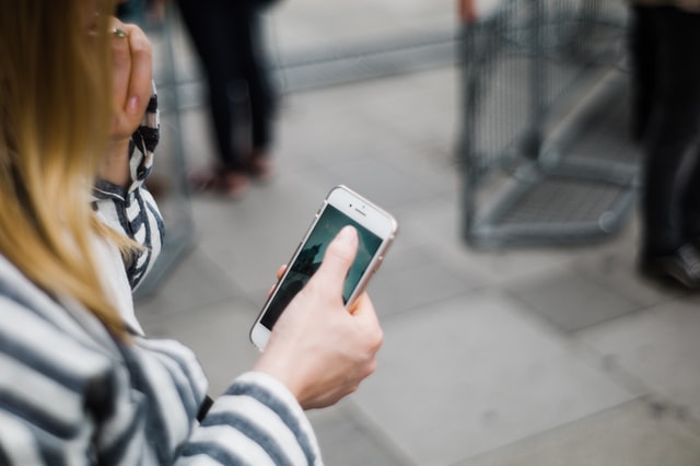 woman testing a website on her phone